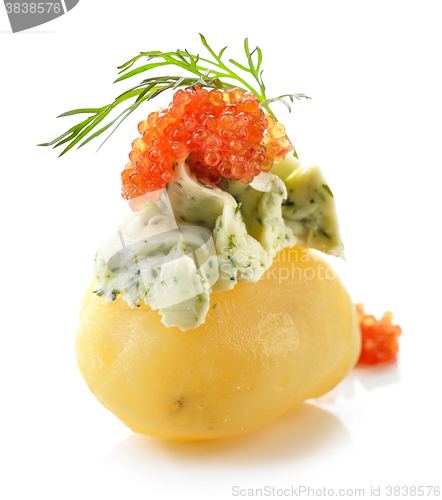 Image of boiled poato decorated with green butter and red caviar