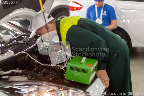 Image of Young car mechanic passes competition stage.Tyumen