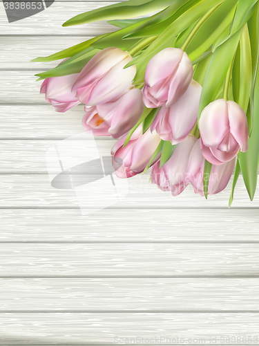 Image of Pink Tulips over wooden table. EPS 10