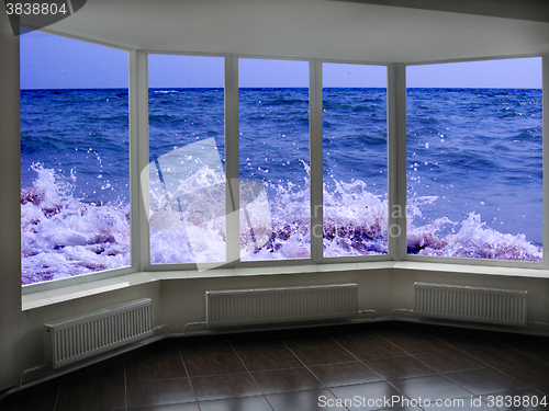 Image of window with view of marine waves