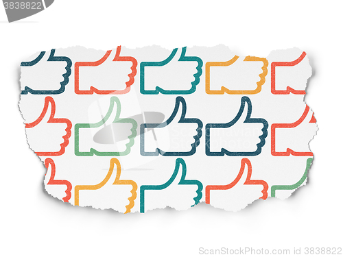 Image of Social media concept: Thumb Up icons on Torn Paper background