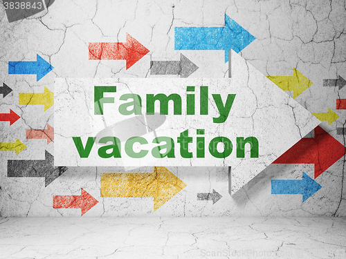 Image of Vacation concept: arrow with Family Vacation on grunge wall background