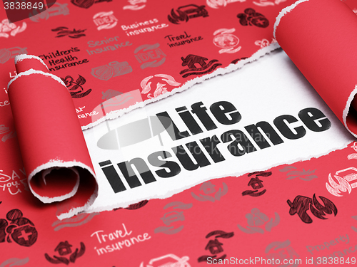 Image of Insurance concept: black text Life Insurance under the piece of  torn paper