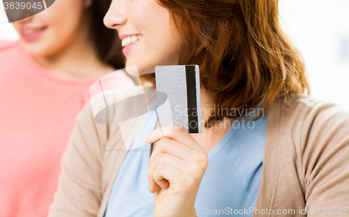 Image of close up of women or friends with credit card