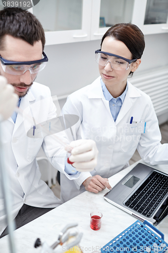 Image of young scientists making test or research in lab