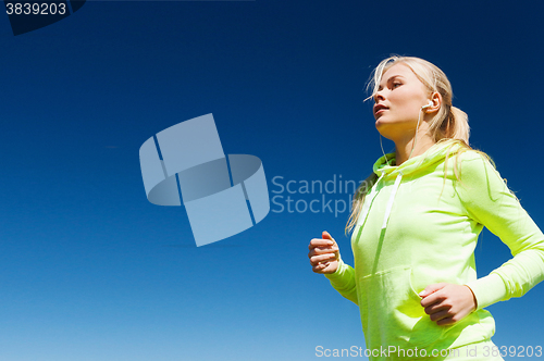 Image of woman doing running outdoors