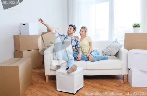 Image of couple with boxes moving to new home and dreaming