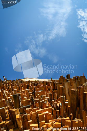 Image of Low angle view of stacked wooden boards