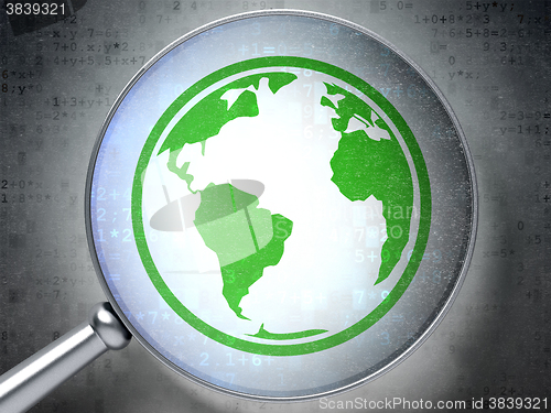 Image of Education concept: Globe with optical glass on digital background