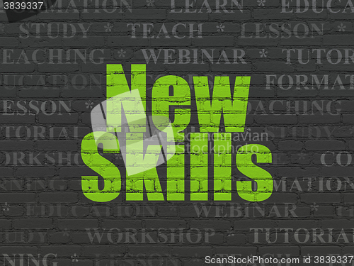 Image of Education concept: New Skills on wall background