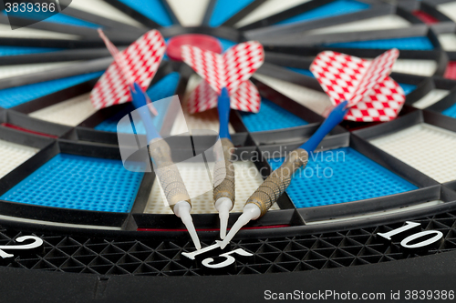 Image of darts board with a dart