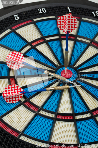 Image of darts board with a dart