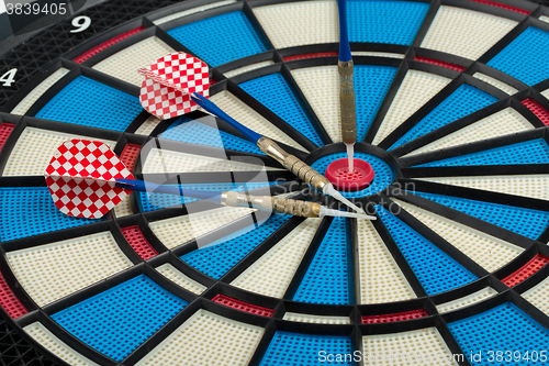 Image of darts board with a dart