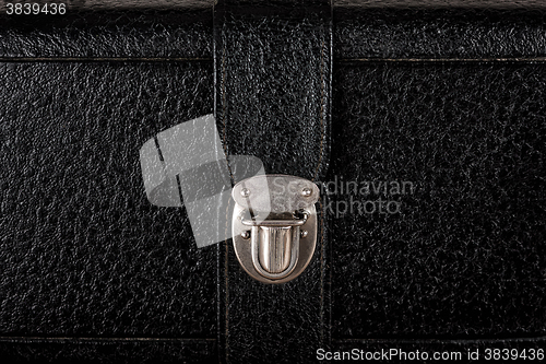 Image of Buckle of old black leather suitcase