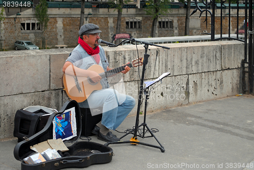 Image of Guitarist on street.