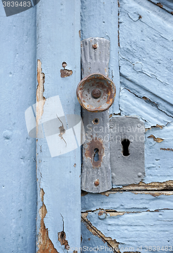 Image of rundown blue door