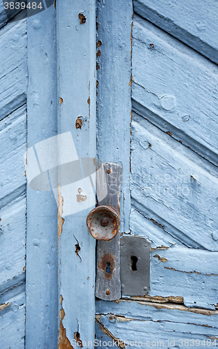 Image of rundown blue door