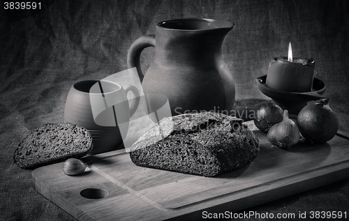 Image of Still life with homemade bread and pottery, black and white phot