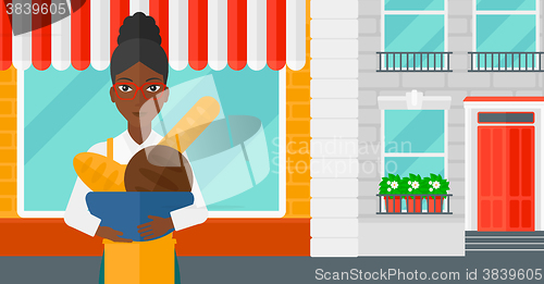 Image of Bakery owner with bread.