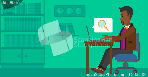 Image of Man working in office.