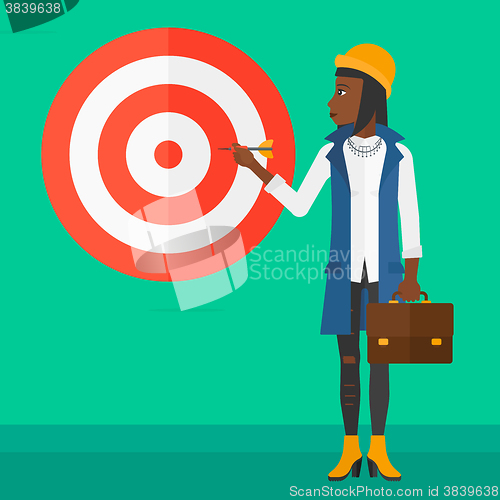 Image of Business woman with target board.