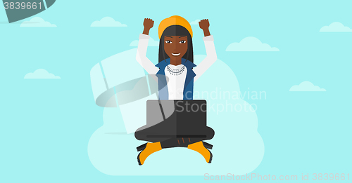 Image of Woman sitting on cloud with laptop.