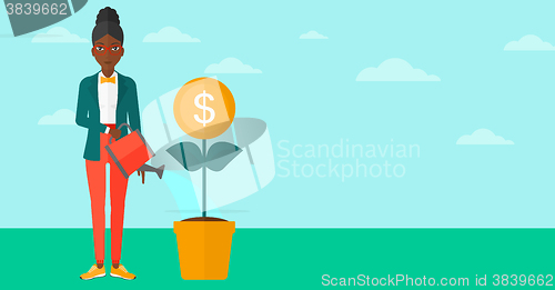 Image of Woman watering money flower.