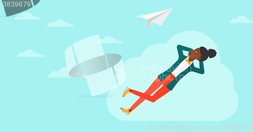 Image of Business woman relaxing on cloud.