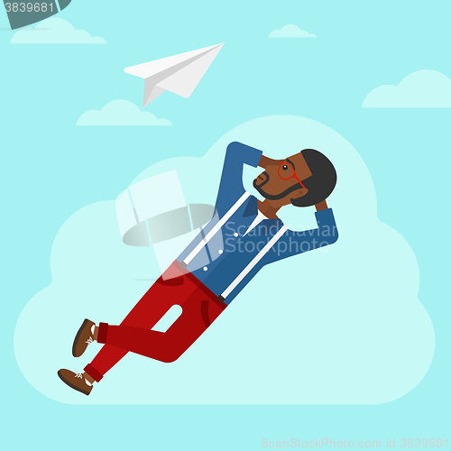 Image of Businessman relaxing on cloud.