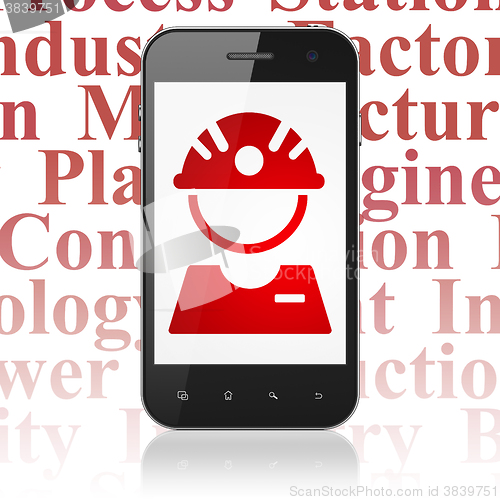 Image of Manufacuring concept: Smartphone with Factory Worker on display