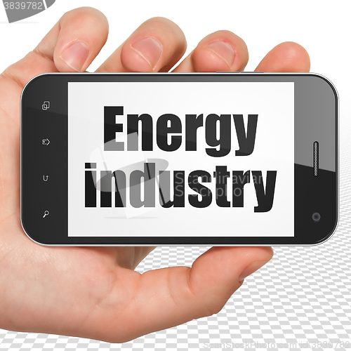 Image of Industry concept: Hand Holding Smartphone with Energy Industry on display