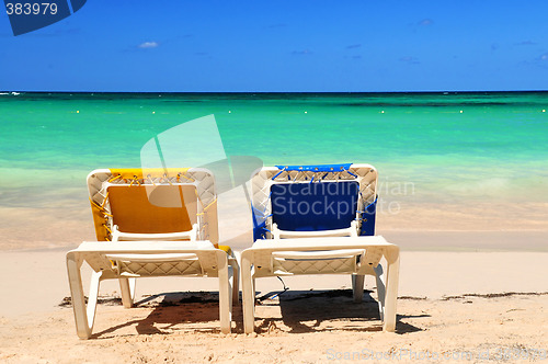 Image of Chairs on sandy beach