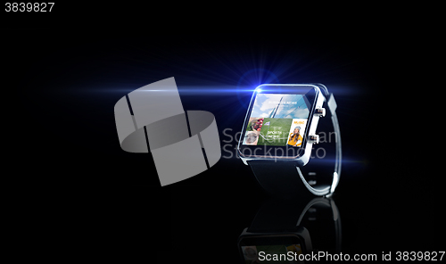 Image of close up of smart watch with media application