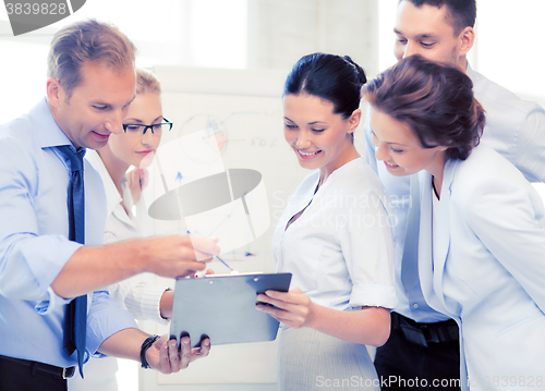 Image of business team discussing something in office