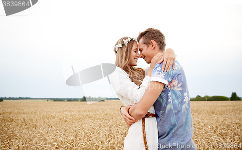 Image of happy smiling young hippie couple outdoors