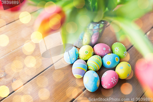 Image of close up of easter eggs and flowers in bucket