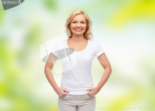 Image of smiling woman in blank white t-shirt