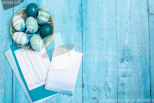 Image of Easter eggs on wooden background