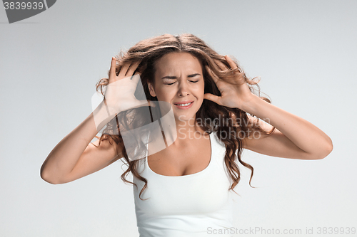 Image of Portrait of young woman with shocked facial expression