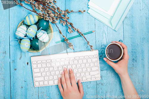 Image of The top view of easter on wooden table office workplace