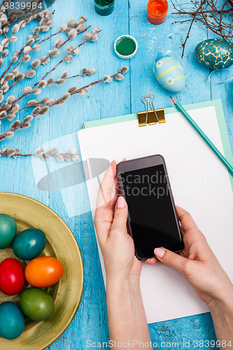 Image of The top view of easter on wooden table office workplace