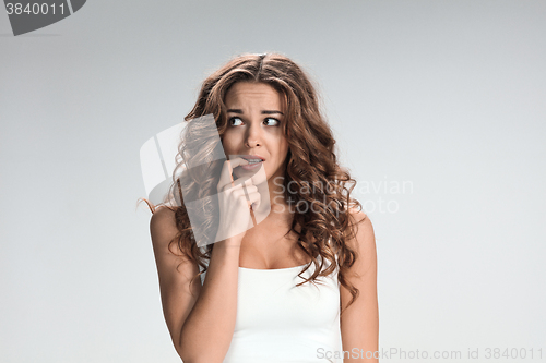 Image of The young woman\'s portrait with frightened emotions