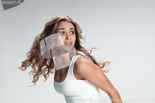 Image of The young woman\'s portrait with frightened emotions