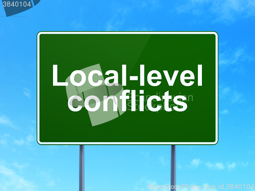 Image of Politics concept: Local-level Conflicts on road sign background