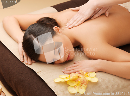 Image of beautiful woman in massage salon