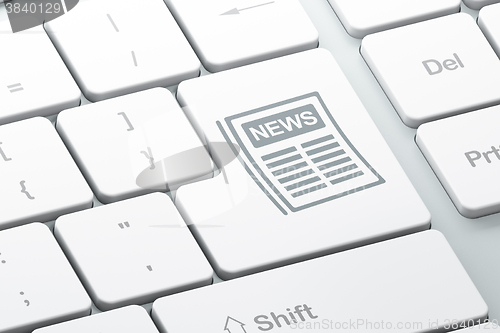 Image of News concept: Newspaper on computer keyboard background