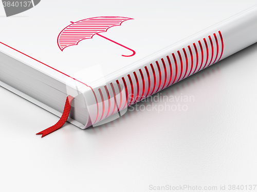 Image of Safety concept: closed book, Umbrella on white background