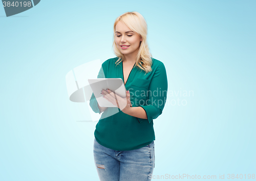 Image of smiling woman with tablet pc computer