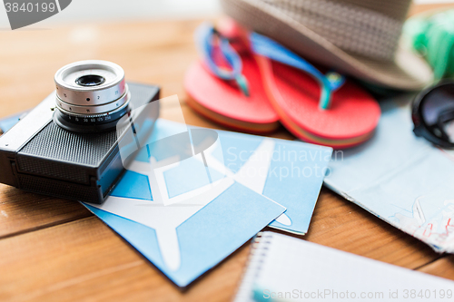 Image of close up of camera, tickets and travel stuff