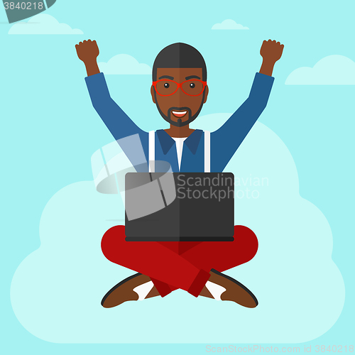 Image of Man sitting on cloud with laptop.